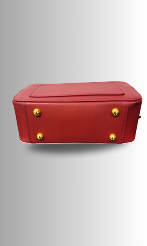 Bottom of duffle bag with gold purse feet for added elegance and protection